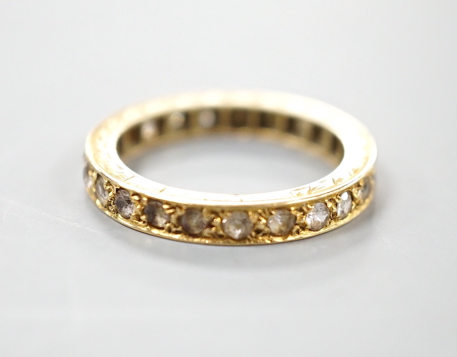 An 18ct and diamond chip set full eternity ring, size L, gross weight 3.4 grams.